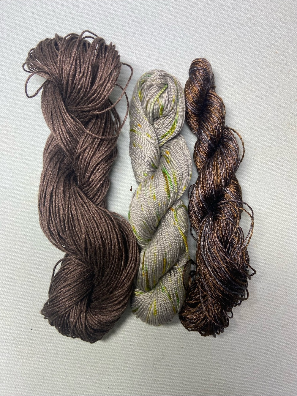 Yarn Trio in Brown, Taupe-Speckle, and Metallic Bronze